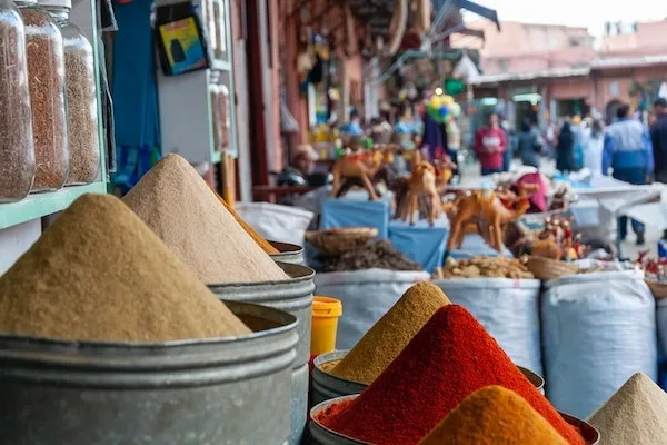 Exploring spice markets during your Morocco desert tour.