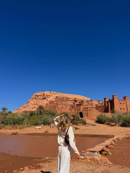 The UNESCO World Heritage site of Ait Ben Haddou in Morocco under a blue sky.