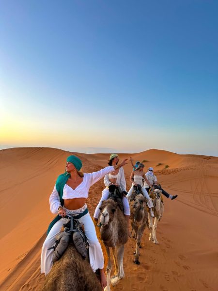 Camel riding experience at sunset in the Sahara Desert as part of a 4 day trip from Marrakech to Fes