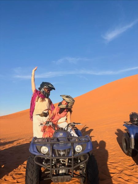 Quad biking adventure through the sand dunes of Merzouga during a Morocco desert excursion