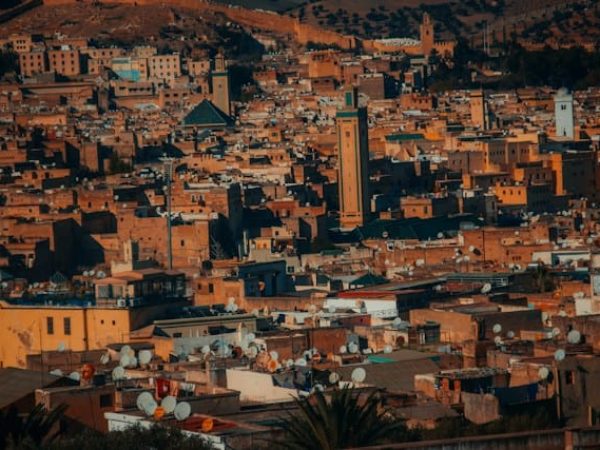 Travelers exploring the narrow streets and traditional souks of Fes Medina