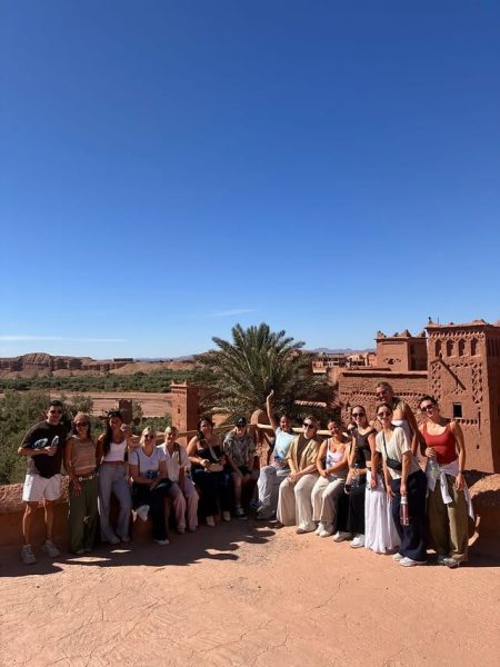 Travel group discovering Ait Ben Haddou Kasbah during a 5-day tour from Fes to Marrakech