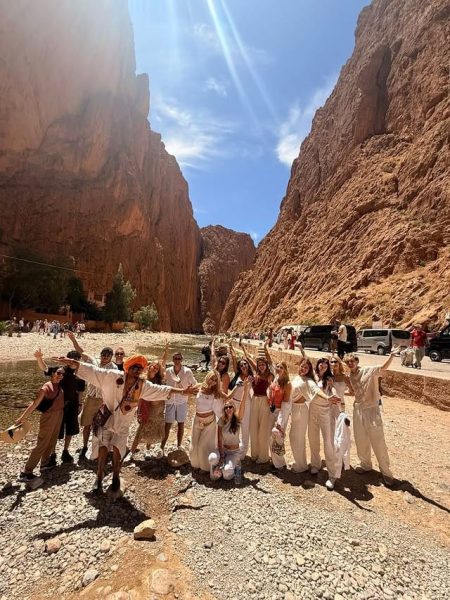 Group of travelers exploring the dramatic cliffs and landscapes of Todra Gorges in Morocco
