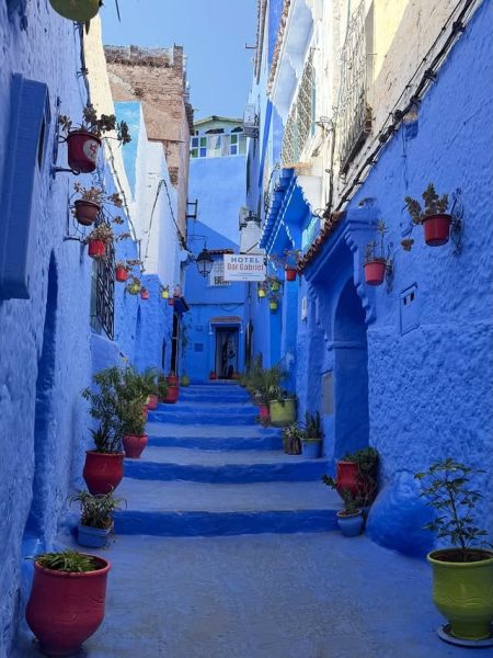 Blue-painted streets of Chefchaouen with traditional Moroccan buildings in the Rif Mountains